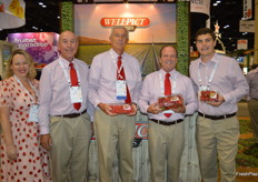 A happy photo of the Well Pict team. The color red is a central theme, not only in the fruit but also the clothing. 